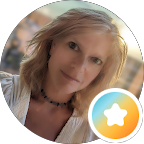 The image features a woman with light hair and a soft smile, set against a blurred background, accompanied by a colorful star emblem at the bottom right.